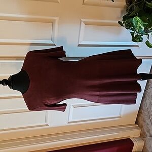 92% polyester 8% spandex, short sleeve, crew neckline, fit and flare.